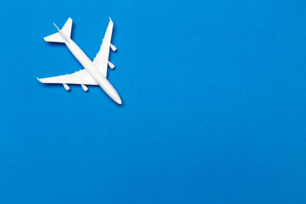 model of passenger plane on blue background