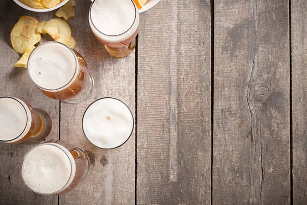 glass beer on wood background