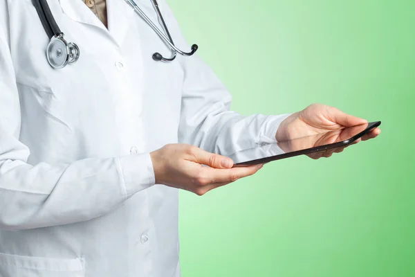 computer tablet in hands of doctor, close-up