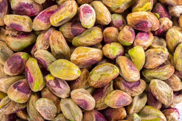 pile of roasted pistachios, close up shot