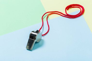 Close up of referee Whistle with red rope clipart