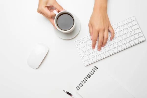 women's hands using keyboard and mouse