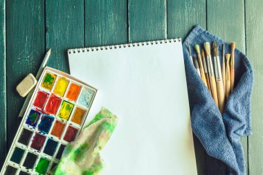 Set of watercolor paints and paintbrushes for painting  clipart