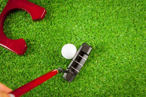 Mini golf equipment on green grass
