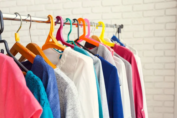 Clothing rack with hangers, close-up view