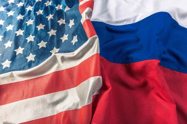 close up view of USA flag and Russia flag