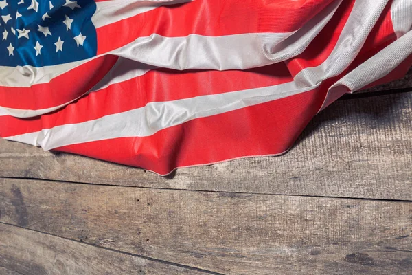 American Flag on weathered rustic wooden background