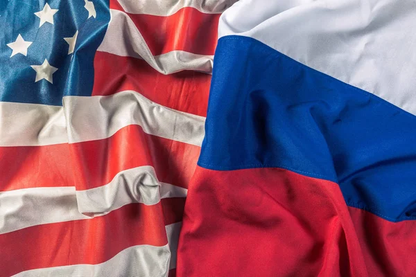 close up view of USA flag and Russia flag