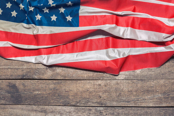 American Flag on weathered rustic wooden background
