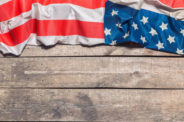 American Flag on weathered rustic wooden background