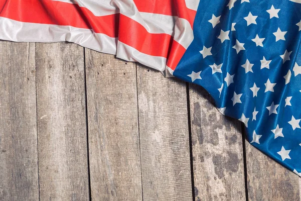 American Flag on weathered rustic wooden background