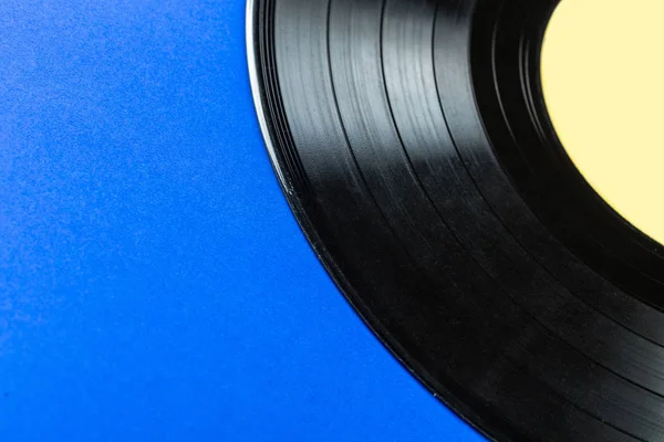 Retro vinil kayıt üzerinde mavi arka plan