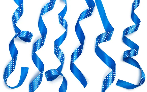 Shiny blue ribbons isolated on white background, close-up