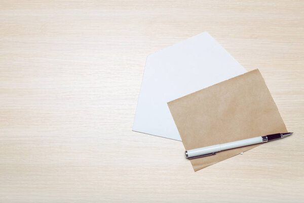 Photo of blank envelope on a  wooden background