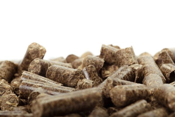 stack of wooden pellets for bio energy, white background, isolated