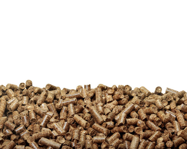 Stack of wooden pellets on white background