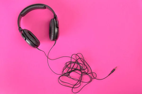 stock image headphones on pink background