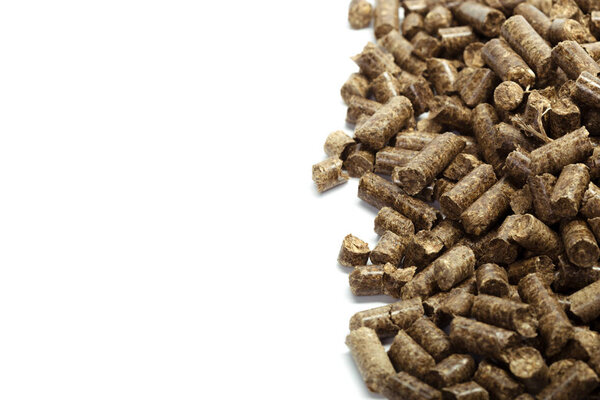 stack of wooden pellets for bio energy, white background, isolated