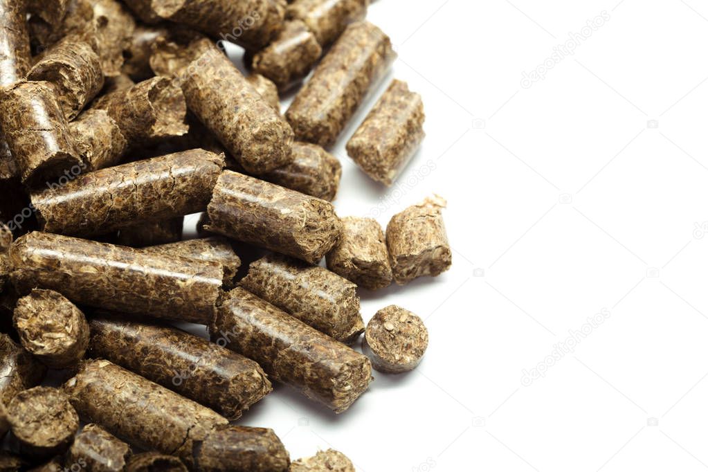 stack of wooden pellets for bio energy, white background, isolated