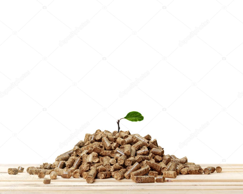 Stack of wooden pellets on white background