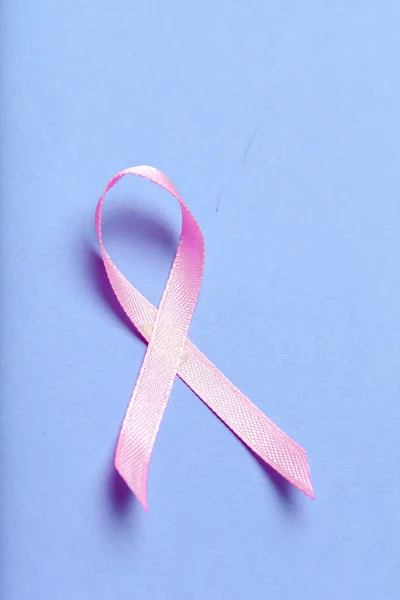 ribbon HIV, AIDS on blue background