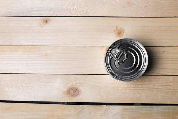 stock image Tin can for food on wooden background