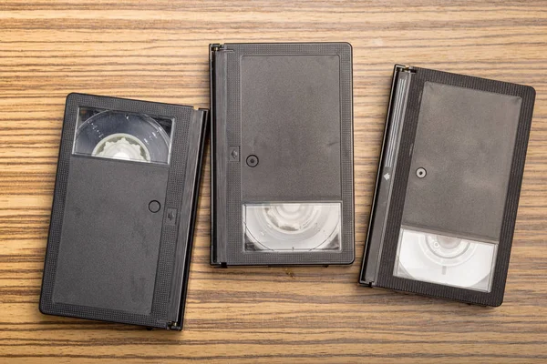 video tape cassette over wooden background