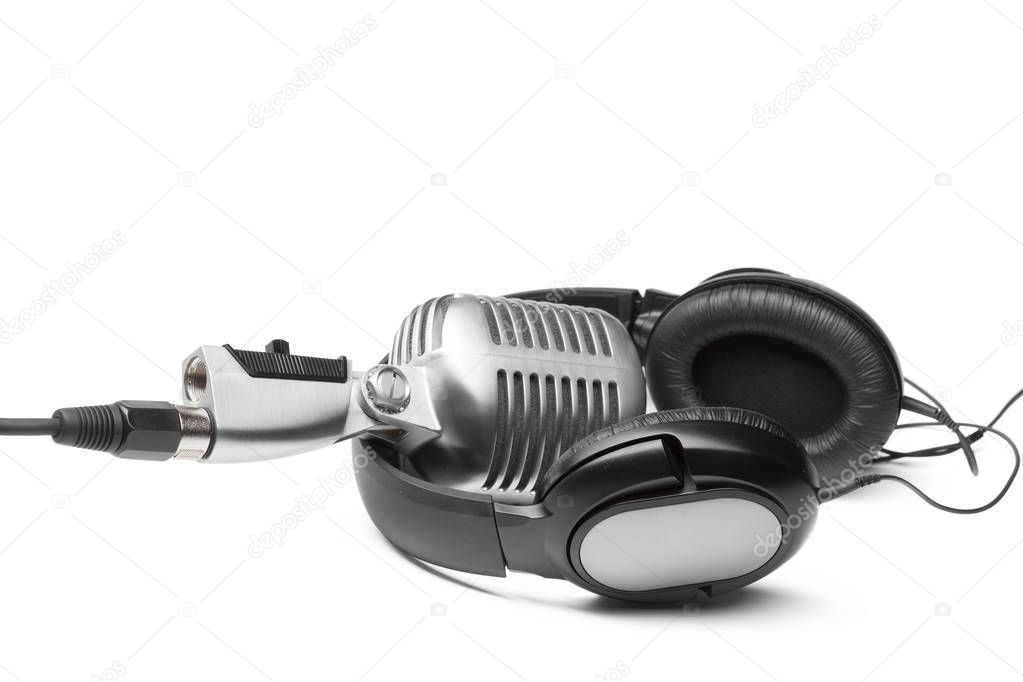 Retro microphone and headphones, close up view