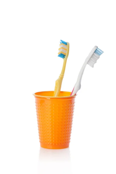 Toothbrushes Orange Glass Isolated White Background — Stock Photo, Image