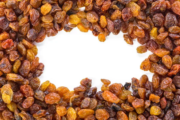 Dried raisins on a white background