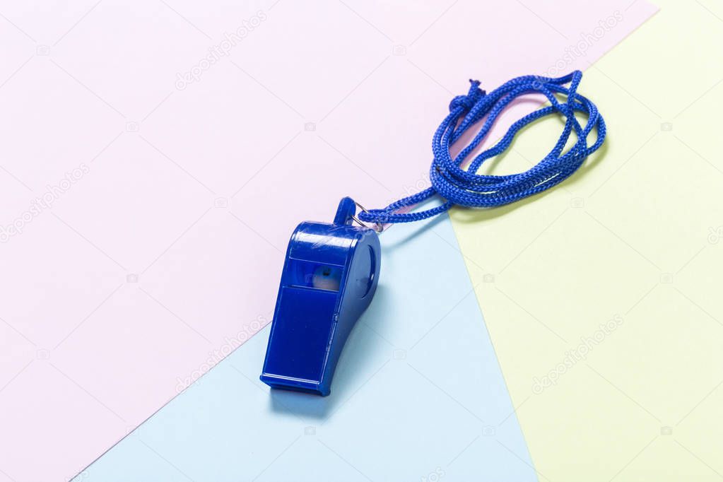 Referee Whistle on light colorful background