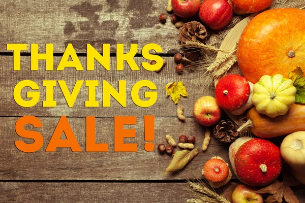Happy thanksgiving day sale on wooden background