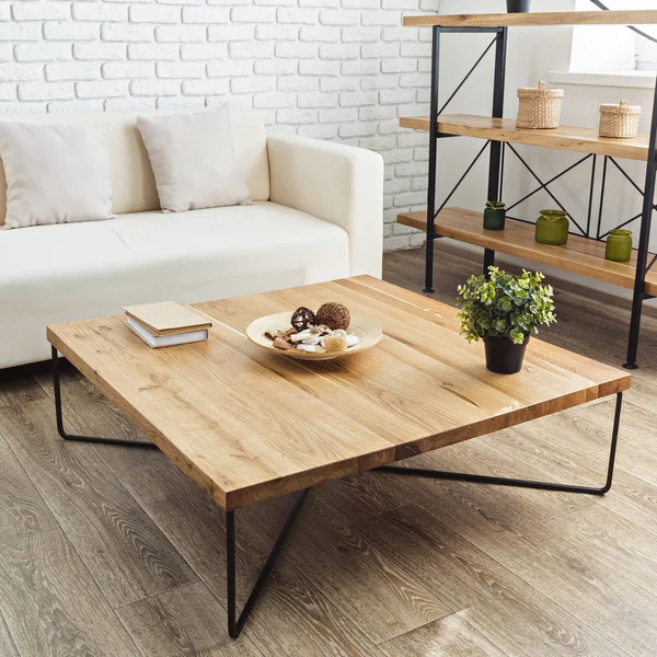 modern wooden table in stylish loft interior