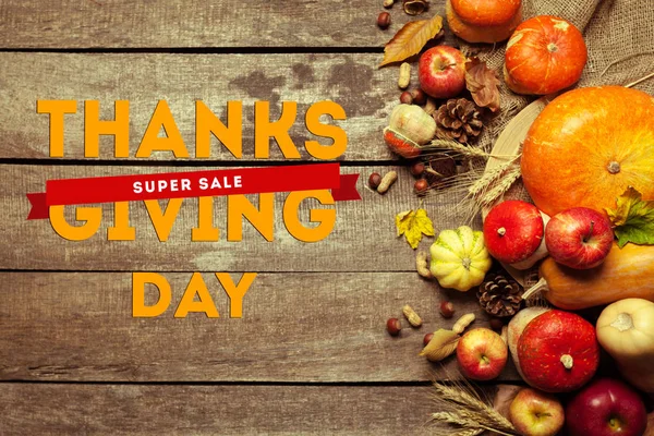 Happy thanksgiving day sale on wooden background