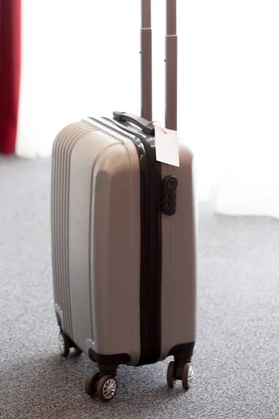 Stylish luggage bag in modern hotel room