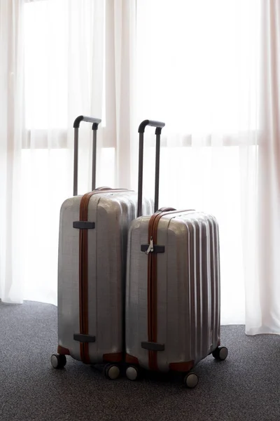 Stylish luggage bags in modern hotel room
