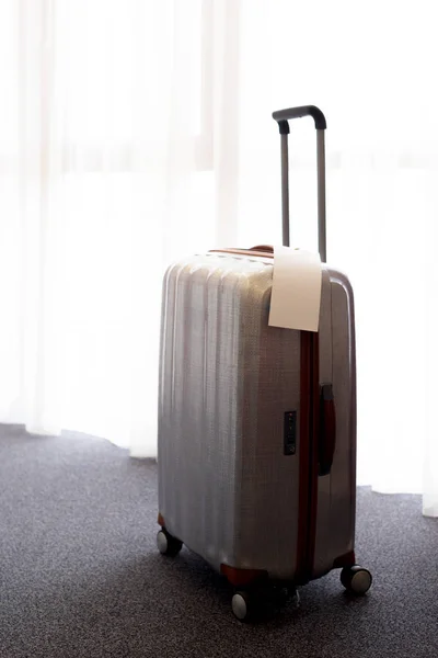 Stylish luggage bag in modern hotel room