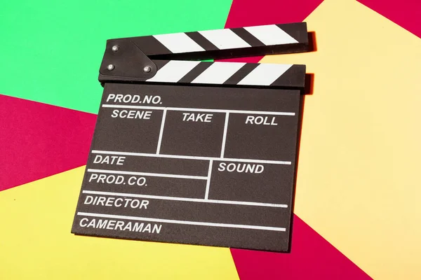close up of Film clapper board on colorful backgroud