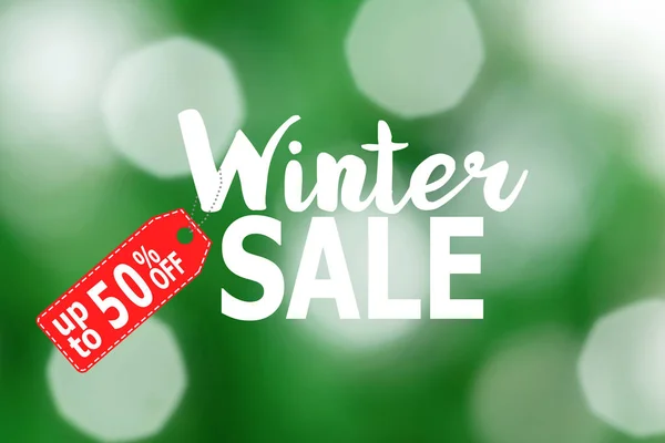 Winter sale poster with blurred elements on green background