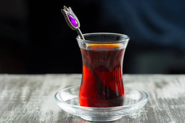 Red tea in turkish glasses on a wooden table