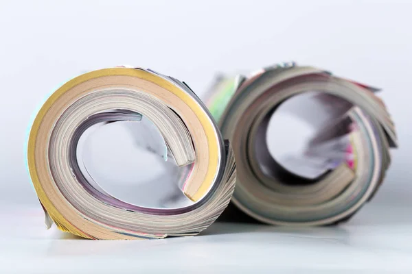 Worn Magazines Twisted Rolls Closeup — Stock Photo, Image