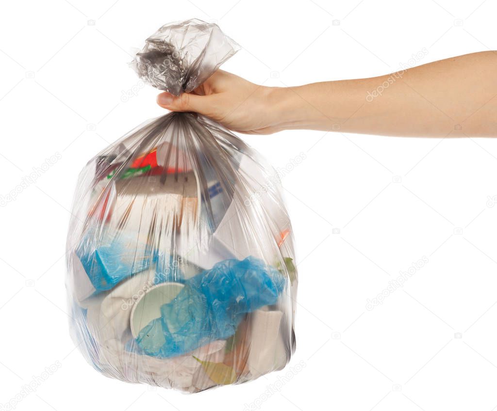 woman hand holding garbage bag isolated on white background