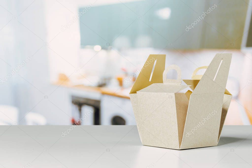 cardboard box on table with defocused background