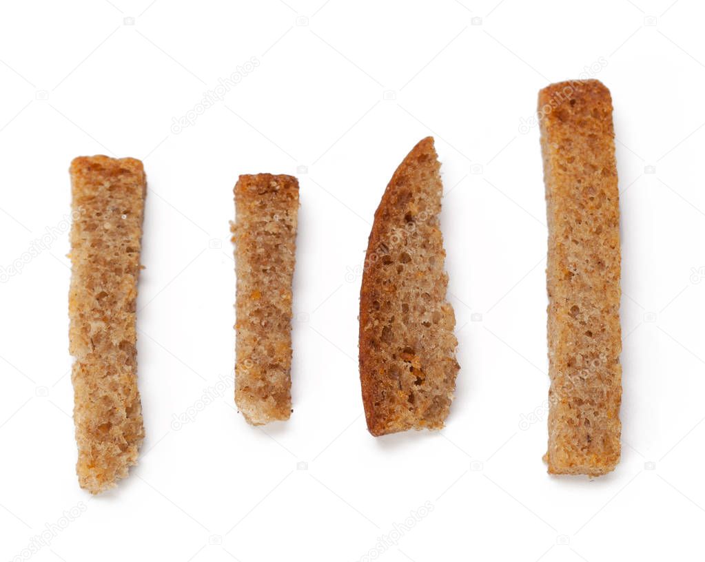 elevated view of crumbs of bread croutons isolated on white background 