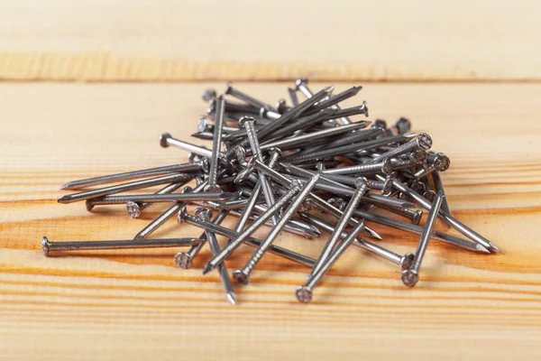 Closeup Iron Nails Wooden Table — Stock Photo, Image