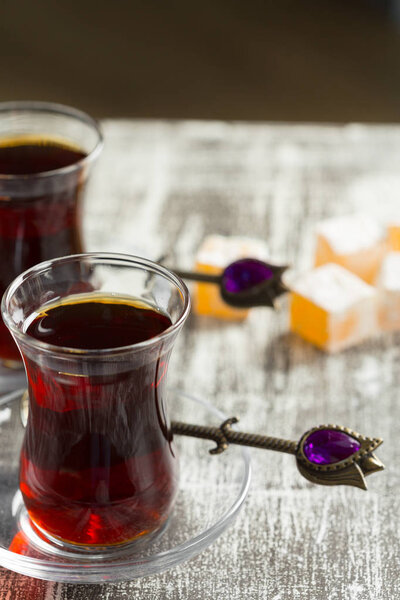 Red tea in Turkish glasses on wooden table