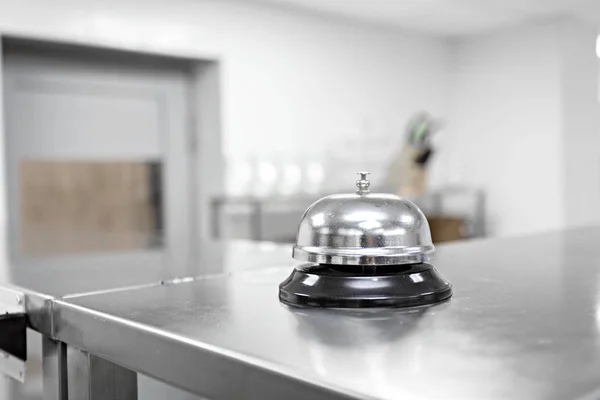 Alert bell on kitchen table in a restaurant