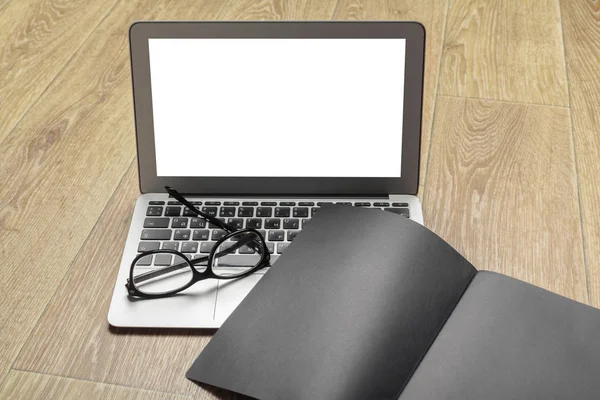 Laptop, notebook on work wooden desk