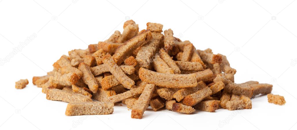 clos eup of crumbs of bread croutons isolated on white background 