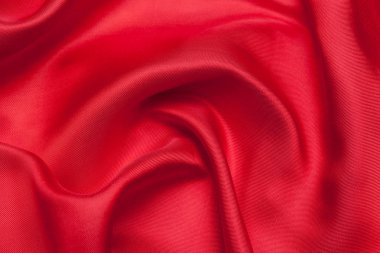 Kırmızı kumaş dalgalar doku arka plan olarak 